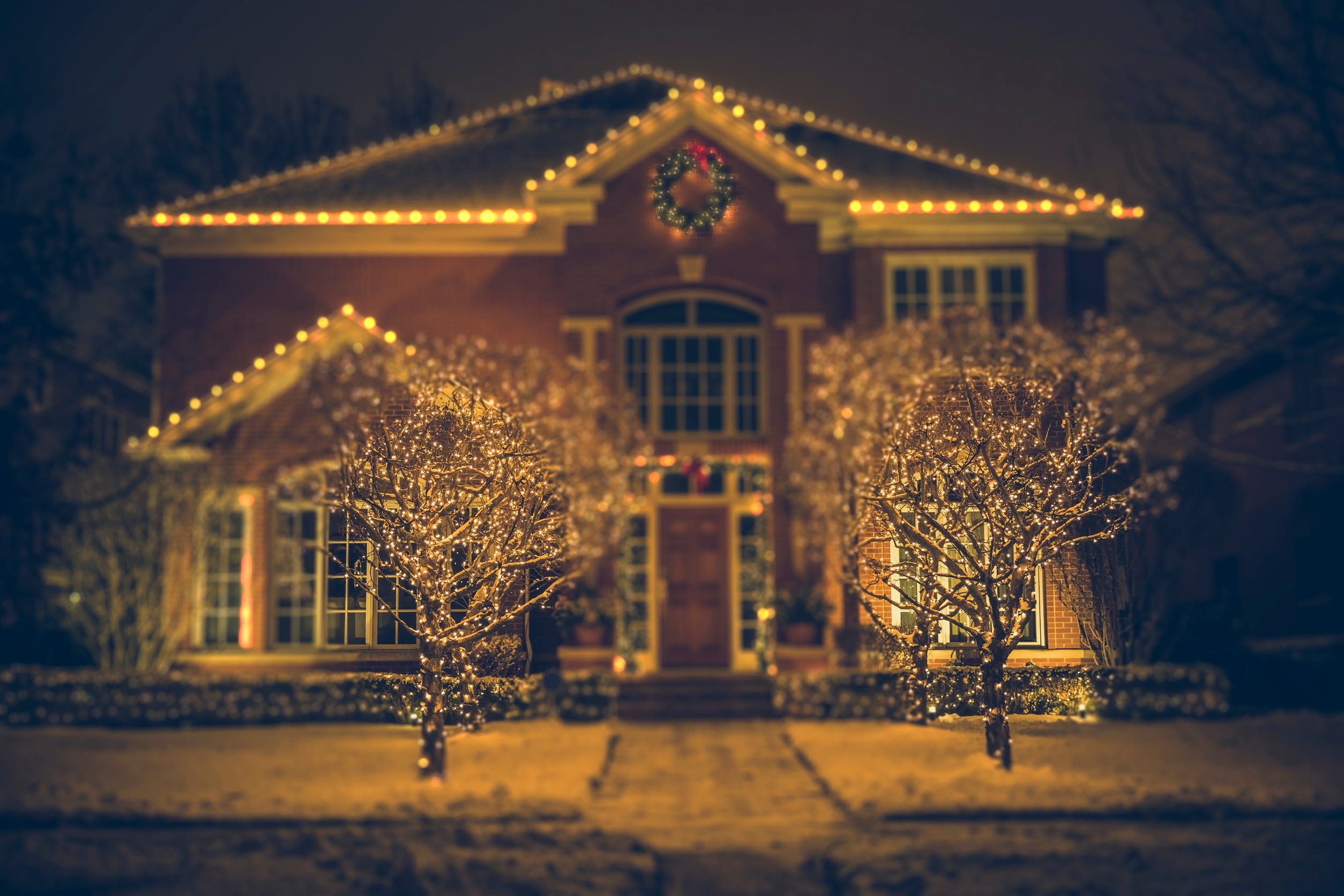 Elegant residential home with warm holiday lighting